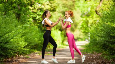 two women exercising park young beautiful woman doing exercises together outdoors