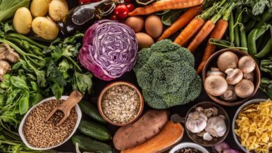 Choice of fresh food and healthy eating: vegetables, fruits, legumes and cereals on a concrete table Top of view.