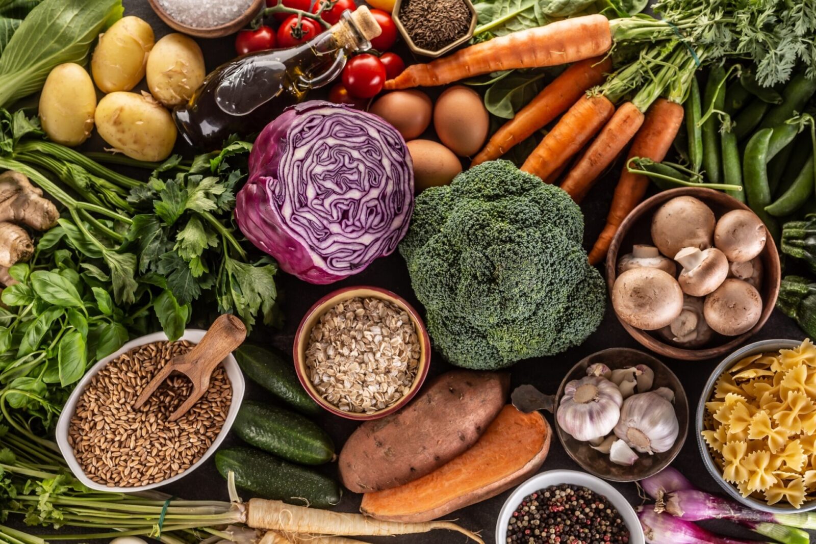 Choice of fresh food and healthy eating: vegetables, fruits, legumes and cereals on a concrete table Top of view.