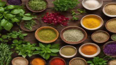 Fresh herbs displayed on wooden table representing natural methods to lower cholesterol.