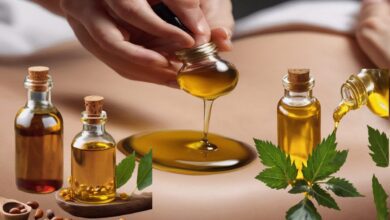 Glass bottle of castor oil next to its plant leaf with a hand applying the oil to a stomach, showcasing its therapeutic benefits