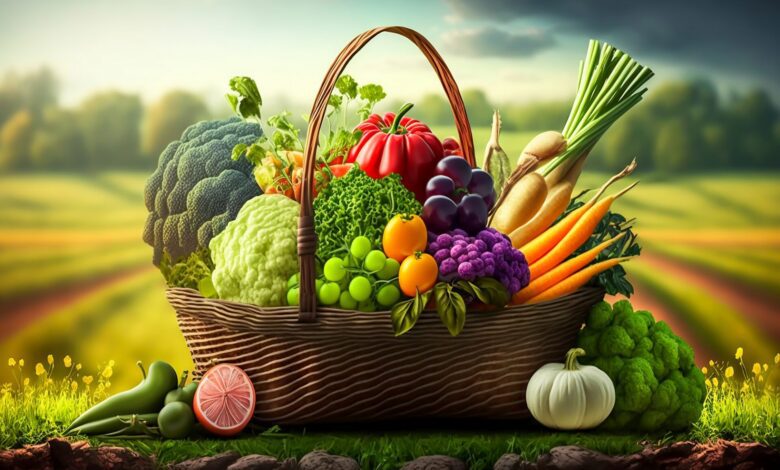 fresh green and mix colored vegetables in big basket in field gr