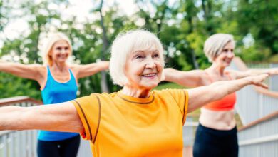 active senior women doing fitness park