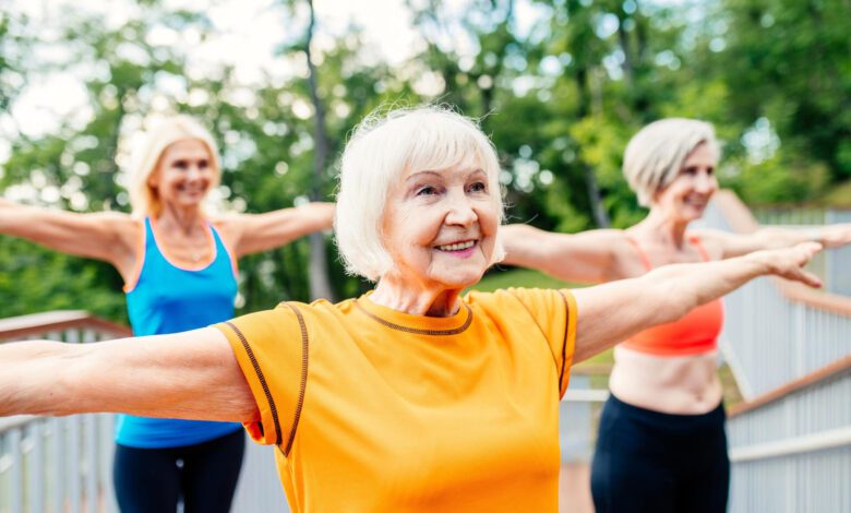 active senior women doing fitness park