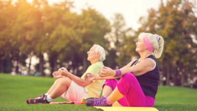 elderly couple doing yoga