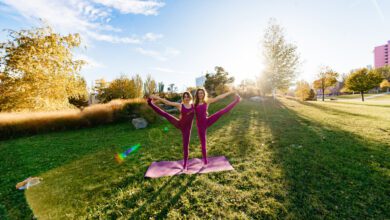 girl doing yoga park relaxing meditating while being surrounded by nature