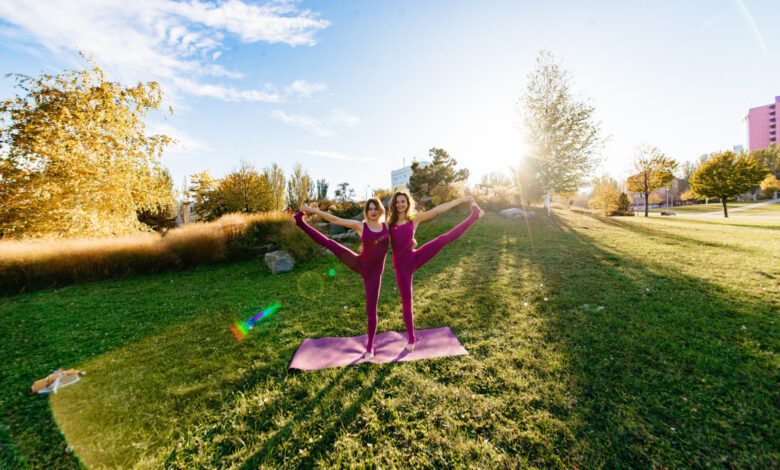 girl doing yoga park relaxing meditating while being surrounded by nature