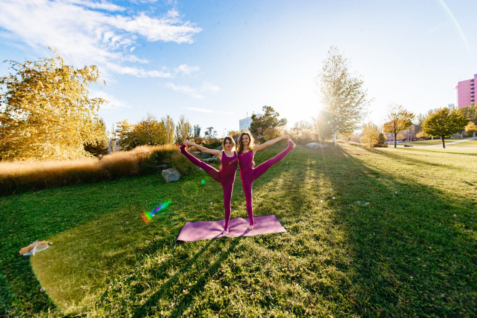 girl doing yoga park relaxing meditating while being surrounded by nature