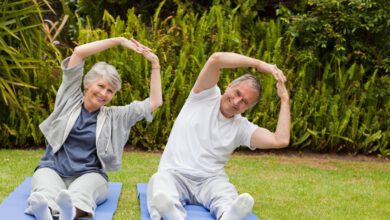 senior couple doing their streches garden