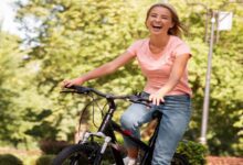 woman riding bike laughing