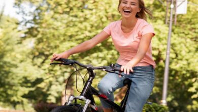 woman riding bike laughing