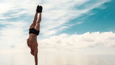 young man is doing street workout handstand exercise bodyweight