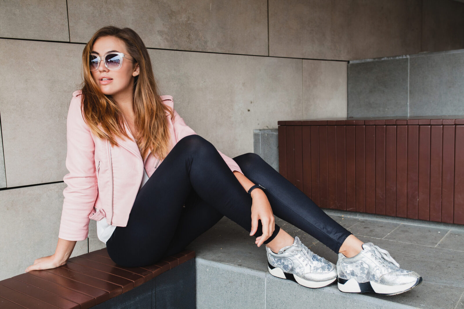 young beautiful stylish hipster woman in pink leather jacket