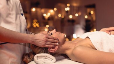 Woman receiving a therapeutic massage in a serene wellness salon setting.