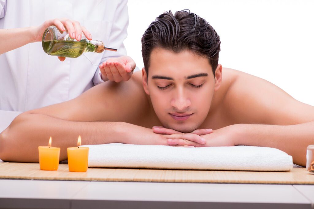 handsome man during spa massaging session