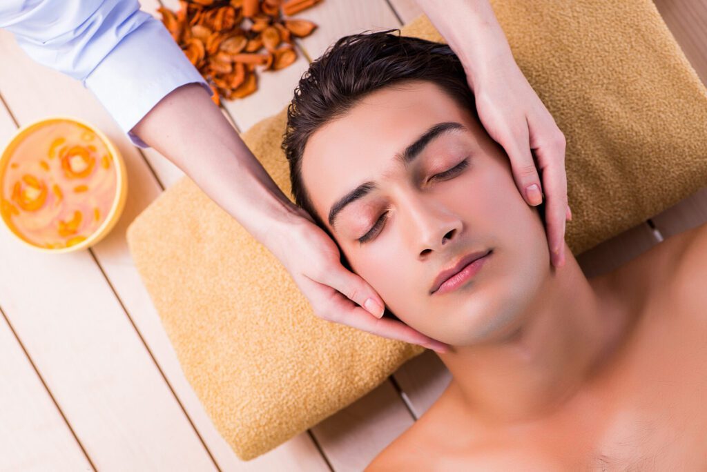 man during massage session spa salon