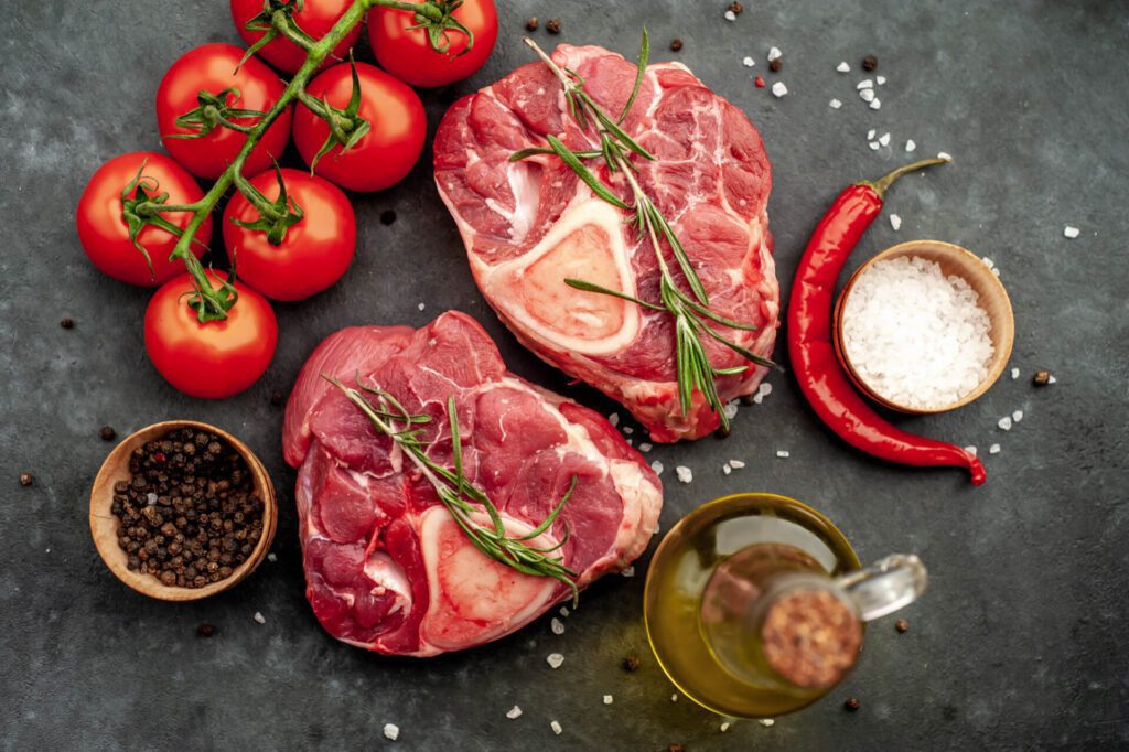 two raw beef steaks with bone spices stone background