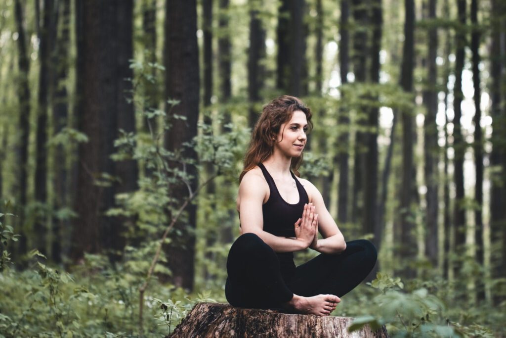 young girl practices yoga forest concept enjoying privacy concentration sunlight
